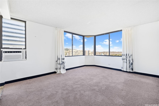 444 Niu St Unit 3806, Honolulu, HI 96815 - carpeted empty room with cooling unit and baseboards