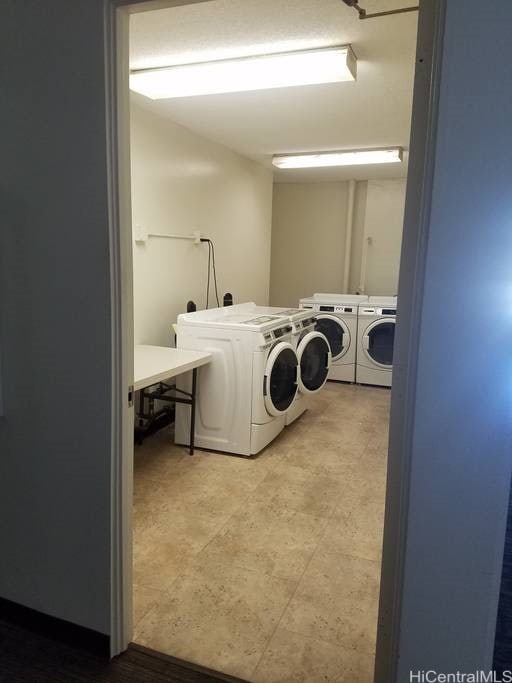 747 Amana St Unit 1515, Honolulu, HI 96814 - community laundry with washer and clothes dryer