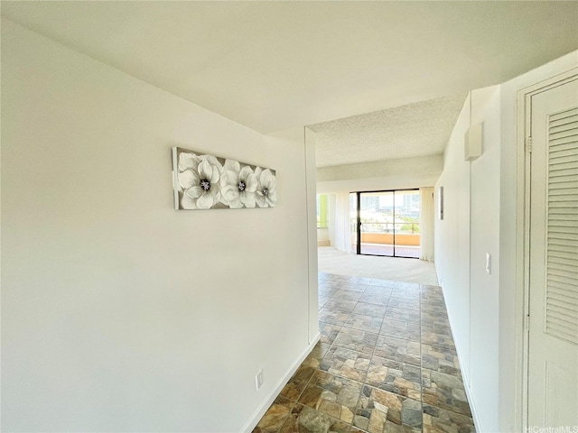 1221 Victoria St Unit 1205, Honolulu, HI 96814 - hallway featuring stone tile floors and baseboards