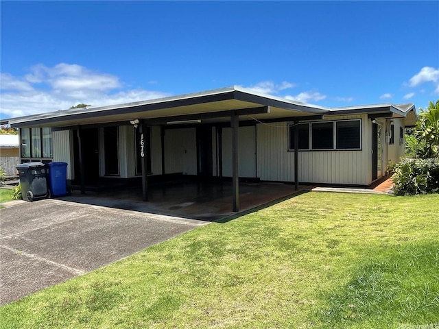 1676 Hoonipo St, Pearl City, HI 96782 - back of house featuring a lawn, an attached carport, and driveway