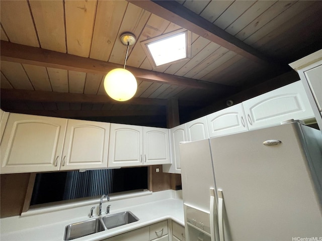 1676 Hoonipo St, Pearl City, HI 96782 - kitchen featuring white refrigerator with ice dispenser, wooden ceiling with exposed beams, a sink, a skylight, and white cabinets