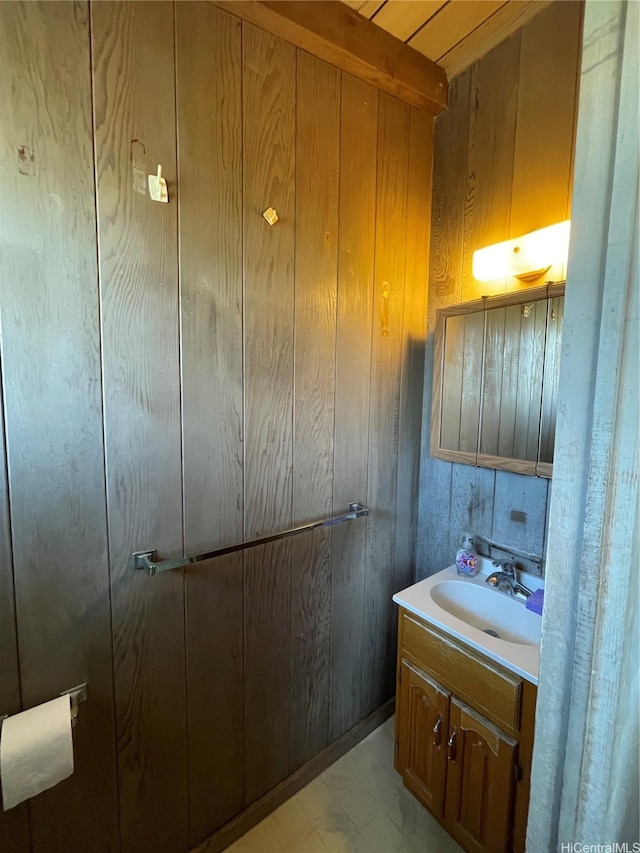 1676 Hoonipo St, Pearl City, HI 96782 - bathroom featuring vanity, wood walls, and marble look tile flooring