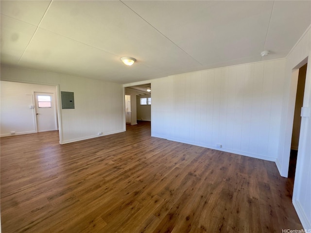 1846 Kilohi St, Honolulu, HI 96819 - unfurnished room featuring dark wood-style flooring, electric panel, a smoke detector, and plenty of natural light