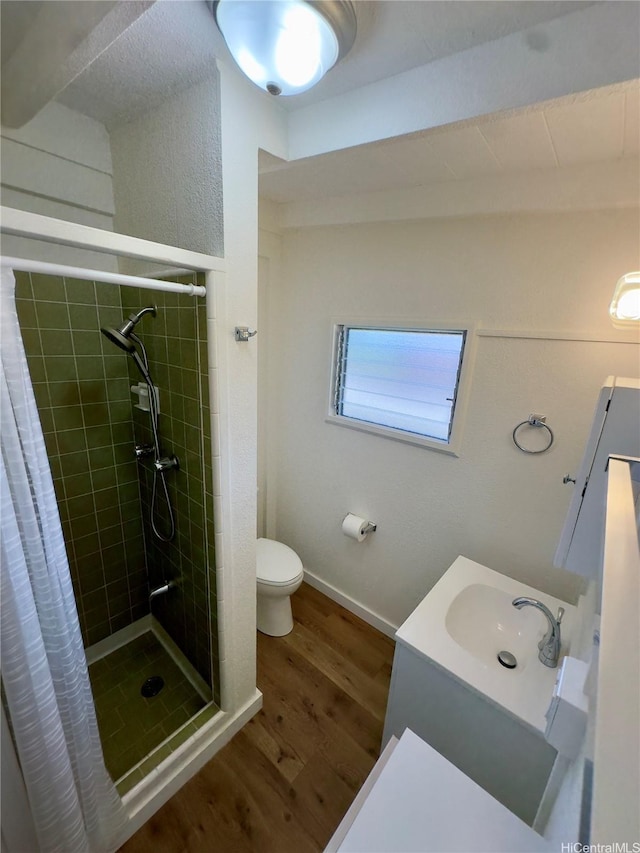 1846 Kilohi St, Honolulu, HI 96819 - bathroom with wood finished floors, a stall shower, and vanity