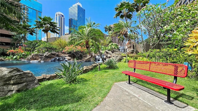 55 S Kukui St Unit D2701, Honolulu, HI 96813 - view of home's community with a garden pond and a lawn