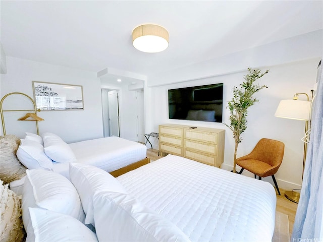 2465 Kuhio Ave Unit 1606, Honolulu, HI 96815 - bedroom featuring light wood-type flooring and baseboards