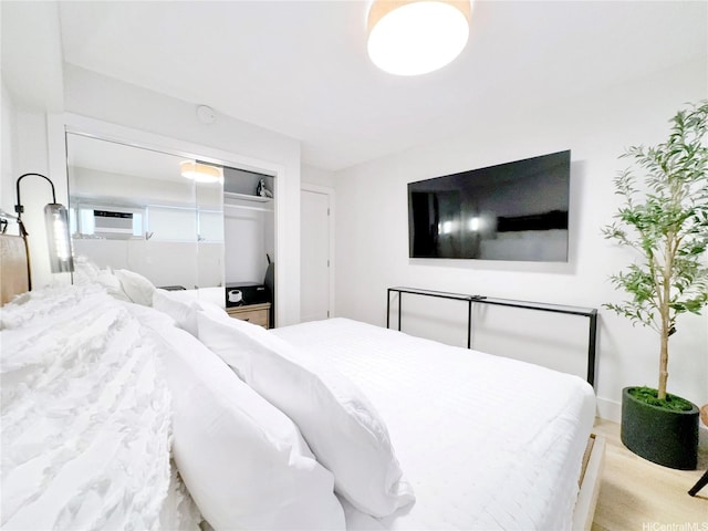 2465 Kuhio Ave Unit 1606, Honolulu, HI 96815 - bedroom featuring a closet and wood finished floors