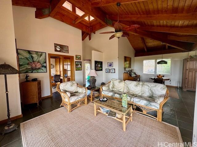 188 Ulua Rd, Kaunakakai, HI 96748 - living area featuring a ceiling fan, wood ceiling with exposed beams, high vaulted ceiling, and baseboards