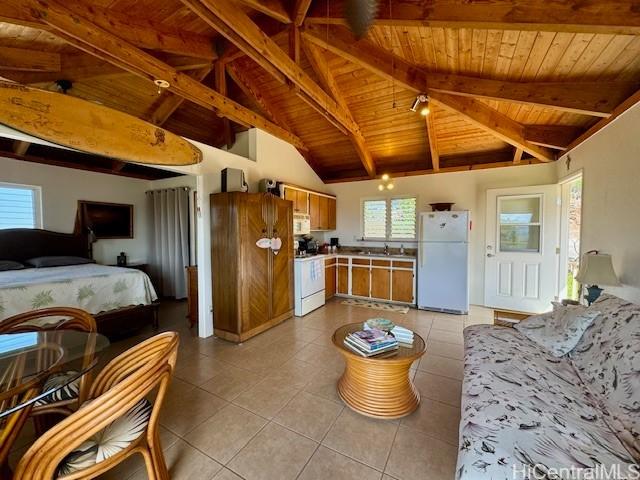 188 Ulua Rd, Kaunakakai, HI 96748 - kitchen featuring white appliances, wood ceiling with exposed beams, light tile patterned floors, a sink, and open floor plan