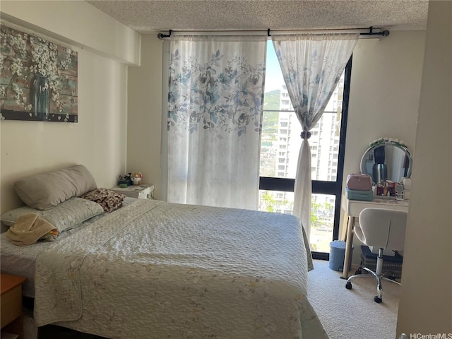 747 Wiliwili St Unit 1403, Honolulu, HI 96826 - bedroom with carpet, a textured ceiling, and a desk