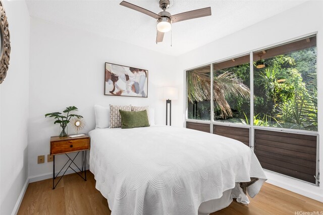 45-407 Mokulele Dr Unit 60, Kaneohe, HI 96744 - bedroom featuring wood finished floors, baseboards, and a ceiling fan