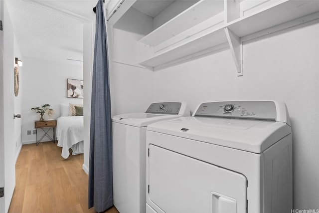 45-407 Mokulele Dr Unit 60, Kaneohe, HI 96744 - laundry area featuring washer and clothes dryer and light wood-type flooring
