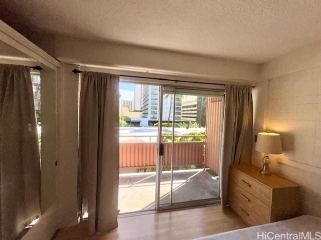417 Nohonani St Unit 513, Honolulu, HI 96815 - entryway with a textured ceiling and wood finished floors