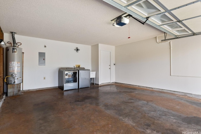94-1444 Okupu St, Waipahu, HI 96797 - garage featuring gas water heater, independent washer and dryer, electric panel, a garage door opener, and baseboards