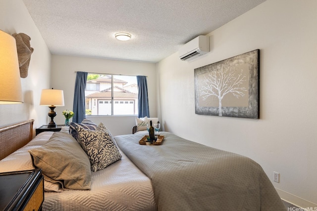94-1444 Okupu St, Waipahu, HI 96797 - bedroom featuring a wall unit AC, a textured ceiling, and baseboards