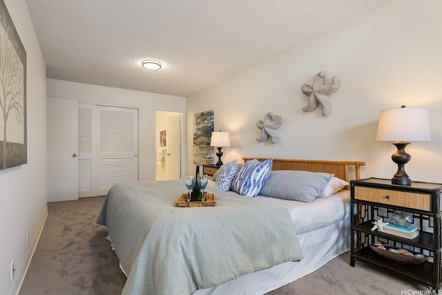 94-1444 Okupu St, Waipahu, HI 96797 - bedroom with carpet flooring, a closet, baseboards, and a textured ceiling