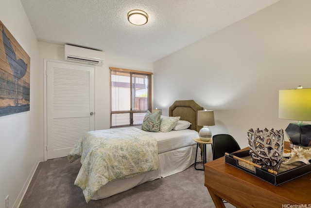94-1444 Okupu St, Waipahu, HI 96797 - bedroom with a wall mounted AC, carpet flooring, a textured ceiling, baseboards, and a closet