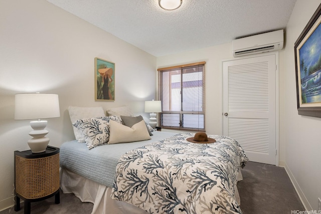 94-1444 Okupu St, Waipahu, HI 96797 - bedroom with a wall mounted AC, carpet floors, baseboards, a textured ceiling, and a closet