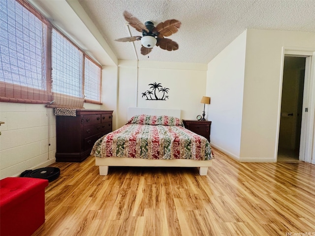 1615 Wilder Ave Unit 401, Honolulu, HI 96822 - bedroom featuring wood finished floors, a textured ceiling, and a ceiling fan