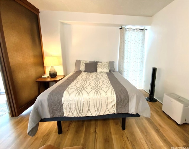 1655 Makaloa St Unit 911, Honolulu, HI 96814 - bedroom with wood finished floors