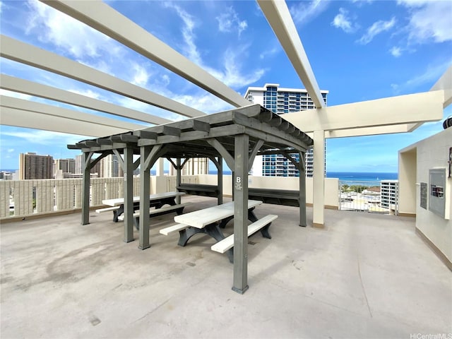 1655 Makaloa St Unit 911, Honolulu, HI 96814 - view of patio / terrace featuring a pergola and a water view