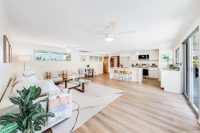 902 Wanaao Rd, Kailua, HI 96734 - living room featuring light wood finished floors and a ceiling fan