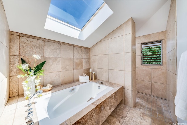902 Wanaao Rd, Kailua, HI 96734 - bathroom featuring a skylight, tile walls, a garden tub, and vaulted ceiling