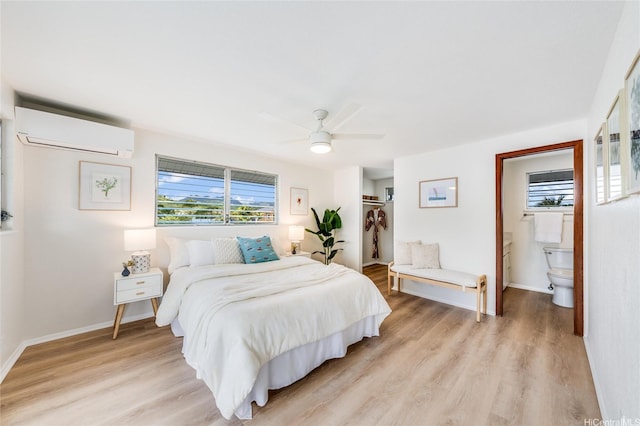 902 Wanaao Rd, Kailua, HI 96734 - bedroom featuring a wall mounted AC, light wood-type flooring, ensuite bath, baseboards, and a ceiling fan