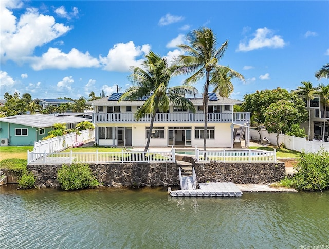 902 Wanaao Rd, Kailua, HI 96734 - rear view of property featuring stairs, a fenced backyard, and a water view