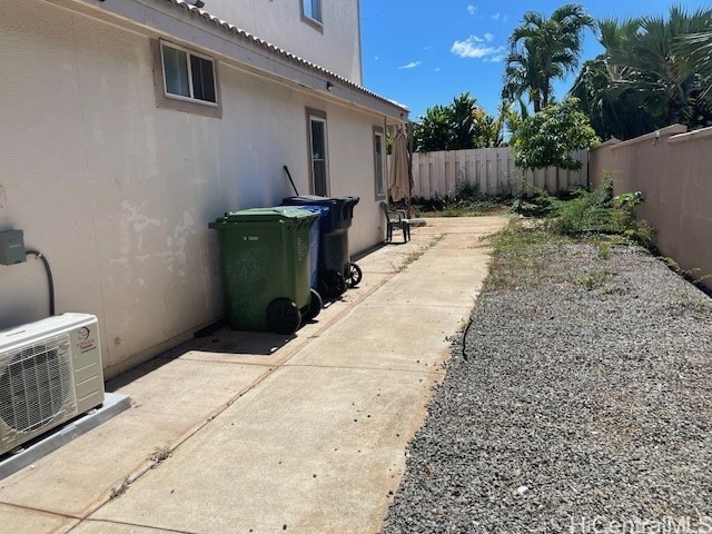 91-1501 Keonekapu St, Ewa Beach, HI 96706 - view of property exterior with a fenced backyard, a cooling unit, a patio area, and stucco siding