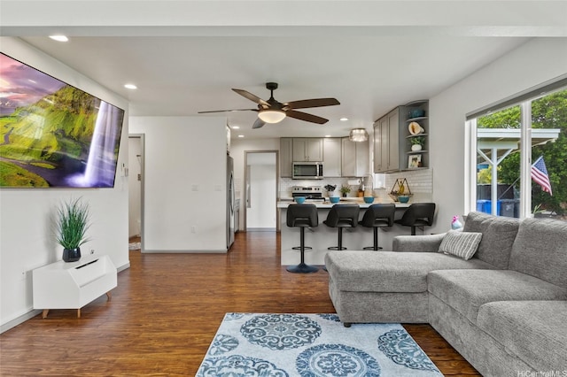 87-230 Holopono St, Waianae, HI 96792 - living area with dark wood-type flooring, ceiling fan, recessed lighting, and baseboards