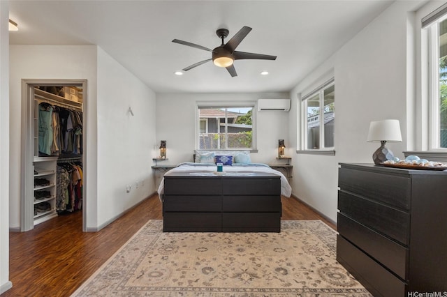87-230 Holopono St, Waianae, HI 96792 - bedroom with a wall unit AC, a spacious closet, wood finished floors, a closet, and recessed lighting
