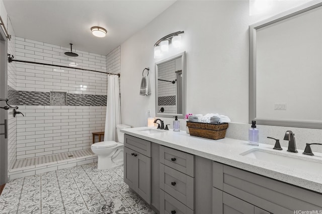 87-230 Holopono St, Waianae, HI 96792 - full bathroom with double vanity, a stall shower, toilet, and tile patterned floors
