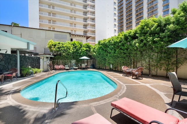 134 Kapahulu Ave Unit 609, Honolulu, HI 96815 - community pool featuring a patio