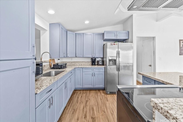 87-1698 Farrington Hwy Unit L, Waianae, HI 96792 - kitchen with stainless steel refrigerator with ice dispenser, range with electric cooktop, a sink, light wood-style flooring, and lofted ceiling