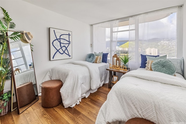 2825 S King St Unit 1403, Honolulu, HI 96826 - bedroom featuring wood finished floors