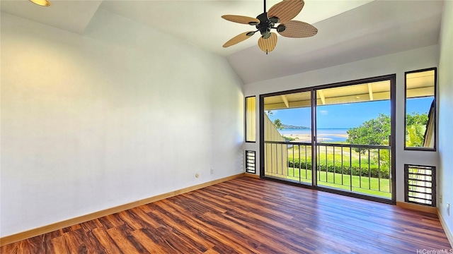 6133 Summer St Unit 6133B, Honolulu, HI 96821 - empty room featuring baseboards, dark wood-style flooring, a water view, and vaulted ceiling