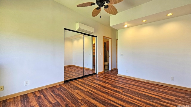 6133 Summer St Unit 6133B, Honolulu, HI 96821 - unfurnished bedroom with dark wood-style flooring, a wall mounted AC, a closet, baseboards, and a ceiling fan