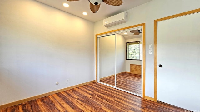 6133 Summer St Unit 6133B, Honolulu, HI 96821 - unfurnished bedroom featuring a wall mounted AC, wood finished floors, baseboards, recessed lighting, and a closet