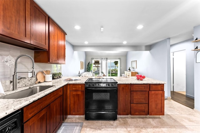44-130 Mui Pl Unit 2605, Kaneohe, HI 96744 - kitchen featuring black appliances, a sink, a peninsula, backsplash, and light stone counters