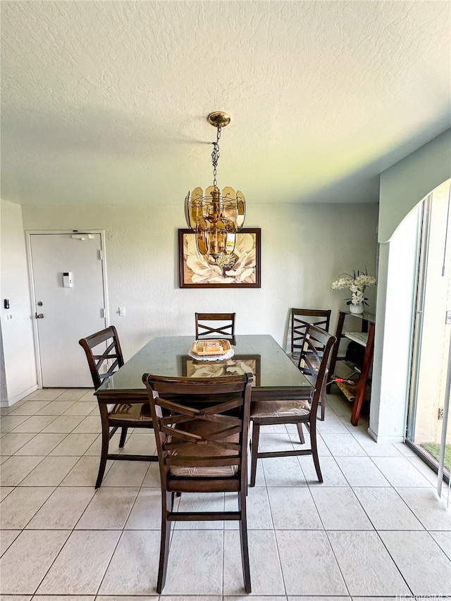 84-664 Ala Mahiku St Unit 196A, Waianae, HI 96792 - dining space featuring a chandelier, light tile patterned floors, and a textured ceiling