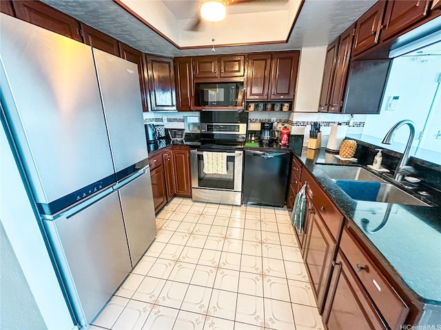 84-664 Ala Mahiku St Unit 196A, Waianae, HI 96792 - kitchen with black appliances, a sink, a tray ceiling, and a ceiling fan