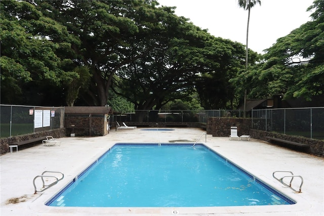 47-665 Hui Kelu St Unit 7702, Kaneohe, HI 96744 - community pool with a patio area and view of wooded area