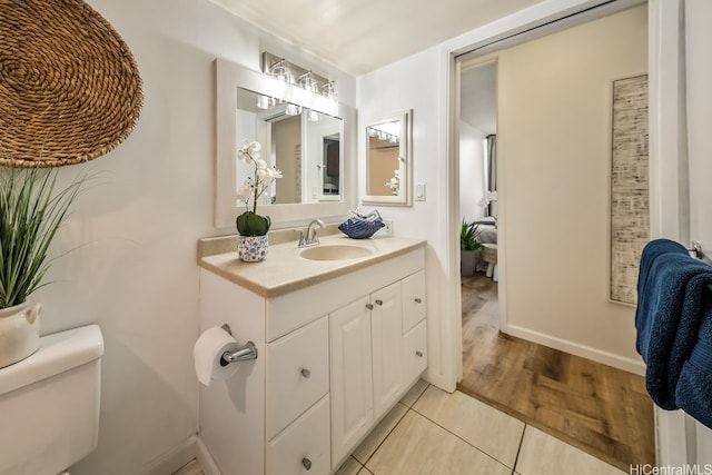 3138 Waialae Ave Unit 230, Honolulu, HI 96816 - bathroom featuring vanity, toilet, tile patterned flooring, and baseboards