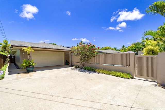 176 Kaiholu St, Kailua, HI 96734 - view of front of house with an attached garage, solar panels, and driveway