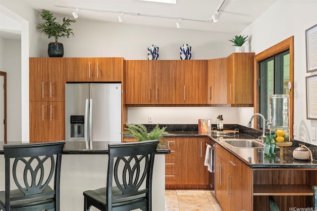 176 Kaiholu St, Kailua, HI 96734 - kitchen with stainless steel refrigerator with ice dispenser, track lighting, a sink, and brown cabinets