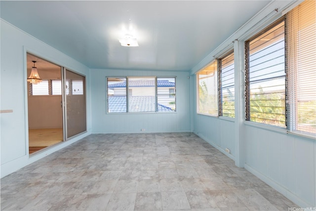 1157 Ala Aloalo St, Honolulu, HI 96818 - unfurnished sunroom featuring plenty of natural light and stone finish floors