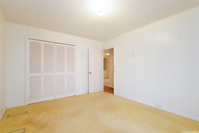 1157 Ala Aloalo St, Honolulu, HI 96818 - unfurnished bedroom featuring carpet, a closet, and a textured ceiling