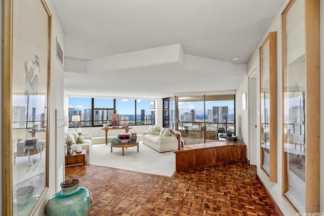 1221 Victoria St Unit 3205, Honolulu, HI 96814 - living area with a view of city and a textured ceiling