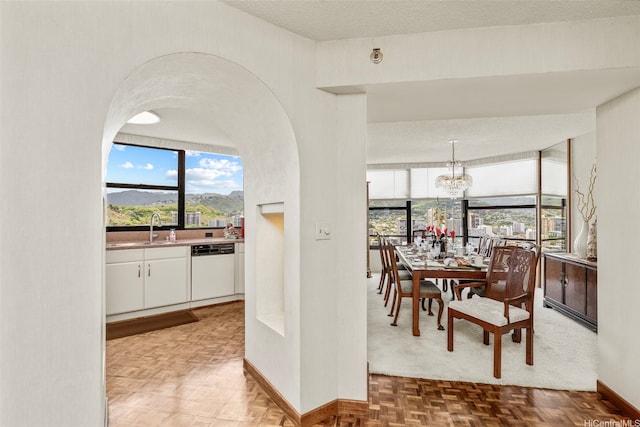1221 Victoria St Unit 3205, Honolulu, HI 96814 - dining room with baseboards and a chandelier